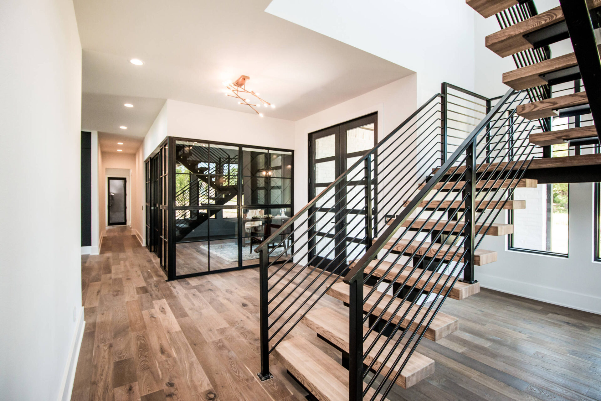 Home - Floating Stairs - Iron Railings