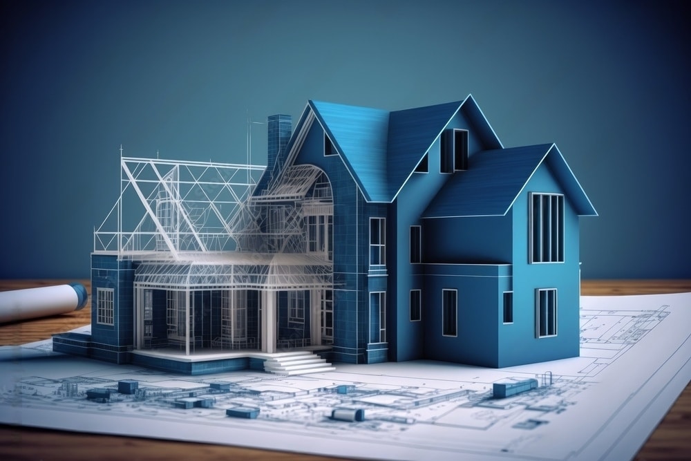 A 3D model of a blue house sits on architectural blueprints. Half of the house is fully built, while the other half is shown as a wireframe, illustrating the design and construction process.